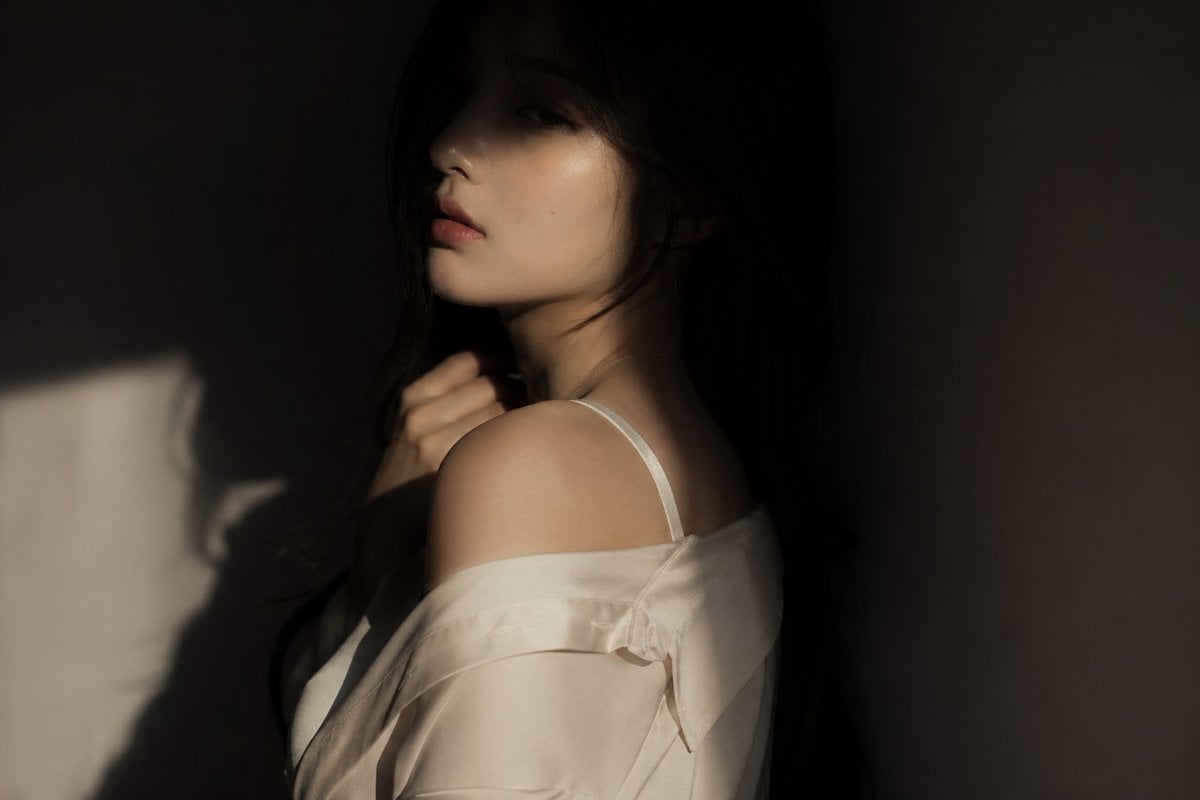 Photography AI image prompt preview: editorial portrait, Korean female idol, subtly sensual outfit: silk shirt or soft fabric top, slightly